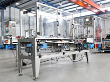 Automatic shrink wrapping machine for canscontinuous