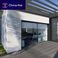 Glass conservatory EXTENS'Kaluminumwith integrated roller shutterwith sliding door
