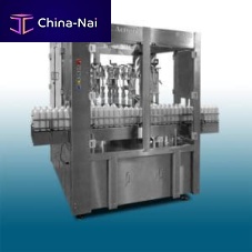 Aerosol spray filling machine with rotary indexing table