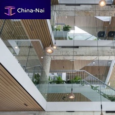 Solid wood suspended ceiling LINEAR CLOAKstripfloatingfor office