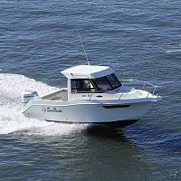 Outboard day fishing boat 635 Fisherwith enclosed cockpittwin-berth