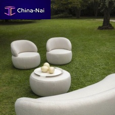 Contemporary armchair Dokufabricroundwith removable cover