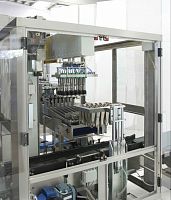 Continuous case packer-unpacker