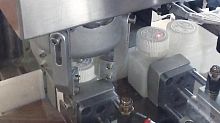 Pharmaceutical product screw capping machine TBlinearelectronically controlledfor plastic screw caps